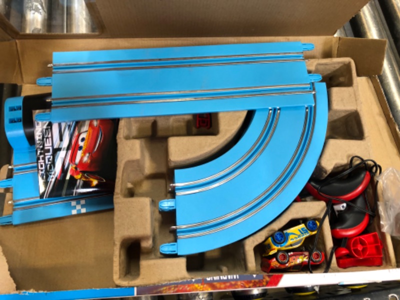 Photo 2 of Carrera First Disney/Pixar Cars - Slot Car Race Track - Includes 2 Cars: Lightning McQueen and Dinoco Cruz - Battery-Powered Beginner Racing Set for Kids Ages 3 Years and Up Disney Cars w/ Spinners