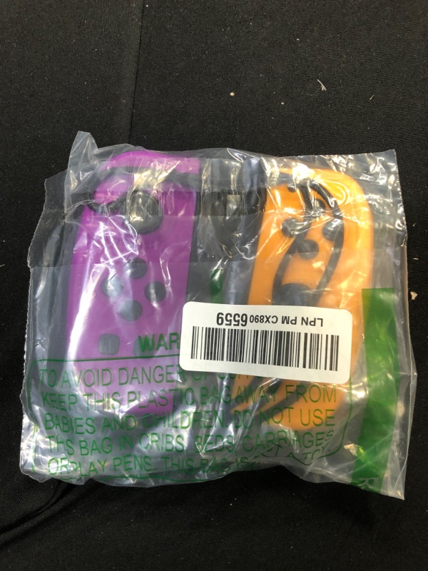 Photo 1 of SWITCH JOY CONS OFF BRAND PURPLE AND ORANGE 