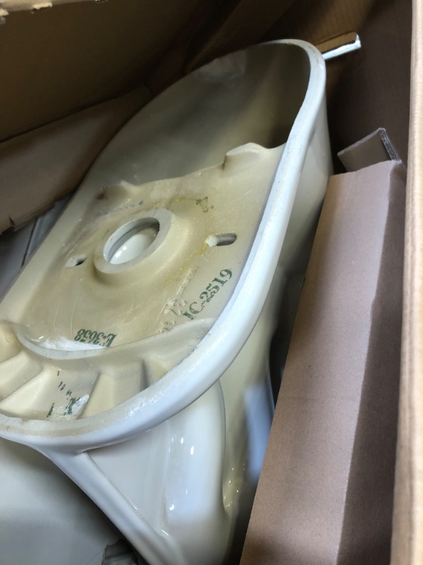 Photo 1 of 10 in. Rough-In 2-piece 1.28 GPF Single Flush Round Front Toilet in White, Seat Included