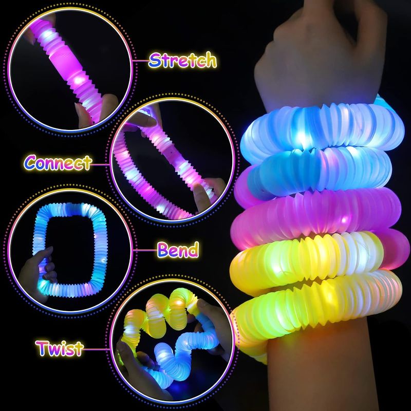 Photo 1 of 18 Piece of Party Favors Sensory Toys for Kid Glow Sticks LED Light Up Pop Fidget Tubes Toddlers Toys Goodie Bag Stuffers Glow in The Dark Party Supplies Return Birthday Party Easter Gifts
