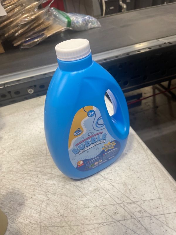 Photo 1 of Bubble Solution Refill 33.8 OZ for Bubble Machine Gun Bubble Wand Blower, Bubbles Kids Toys for Birthday Christmas Wedding Party Favors Gifts
