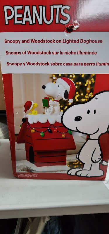 Photo 7 of 19" Peanuts Snoopy & Woodstock Holiday Dog House. For Indoor Decorative Use Only. The beloved Peanuts characters, Snoopy & Woodstock, have become synonymous with the Holidays since their debut over 70 years ago. Bring the magic of these cherished characte