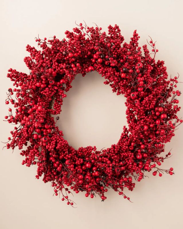 Photo 1 of KIRLAND Holiday 28" Artificial Red Berry Wreath. When fully shaped, this wreath measures 28"L x 7"W x 28"H. Accentuate your space with this festive red wreath. Hang on your door, mantel, or use as a centerpiece decoration surrounded by your favorite Winte