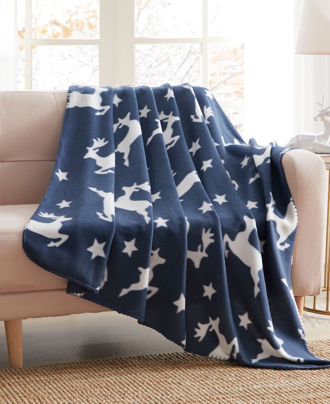 Photo 1 of Birch Trails Holiday Printed Fleece Throw, 50" X 60". Cozy up on your bed or sofa with these fun, Holiday inspired throws by Birch Trails. They are perfect for snuggling up in the bed, on the couch or around a campfire. Hemmed on all sides for a high-qual
