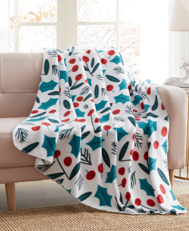 Photo 1 of Birch Trails Holiday Printed Fleece Throw, 50" X 60". Cozy up on your bed or sofa with these fun, Holiday inspired throws by Birch Trails. They are perfect for snuggling up in the bed, on the couch or around a campfire. Hemmed on all sides for a high-qual