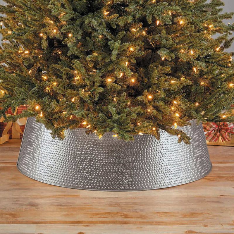 Photo 1 of Holiday Christmas Metal Tree Collar 35" Base x 10" Tall GOLD. rade in that old tree skirt and take the ironing out of hiding and protecting the base of your Christmas tree! Accommodates most trees with its 35” base diameter and 9.84” height. The tree coll