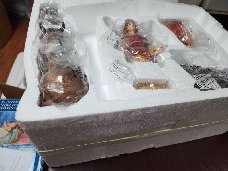 Photo 1 of Kirkland Signature Hand-Painted Christmas Nativity 13-Piece Set. 13-Piece Nativity Set. Hand-crafted and hand-painted with intricate detailing to build each piece. No assembly required. Includes: Manger, Cradle, Baby Jesus, Mary, Joseph, Angel, 3 Wise Men
