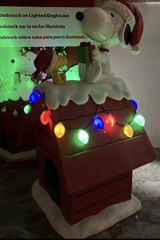 Photo 3 of Peanuts 19 Inch (48.5cm) Snoopy and Woodstock Holiday Dog House with LED Lights. The beloved Peanuts characters, Snoopy and Woodstock, have become synonymous with the Holidays since their debut over 70 years ago. Bring the magic of these cherished charact