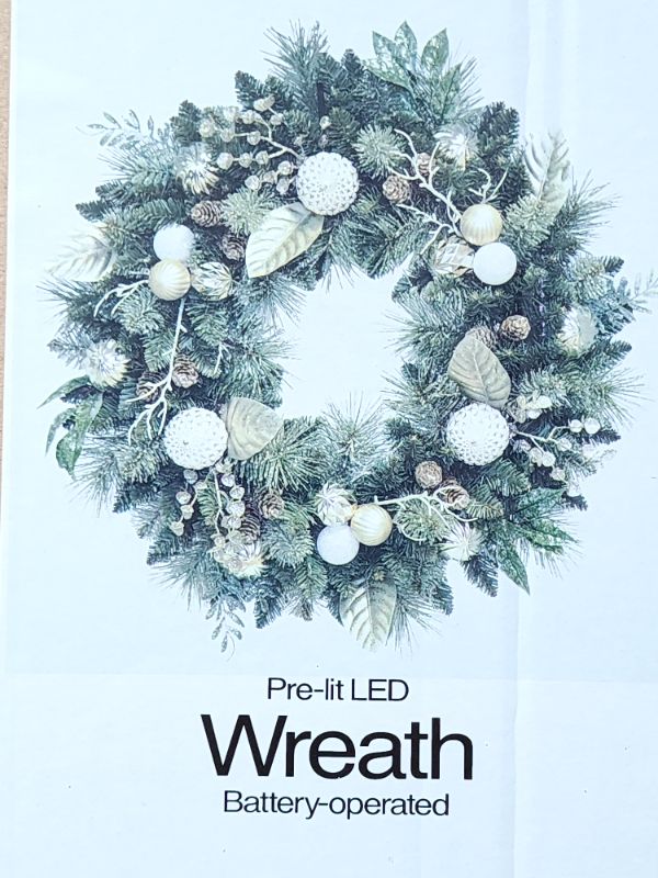 Photo 2 of COSTCO The Pre-Lit Battery Operated 32-Inch Wreath with Dual Color LED Lights Pinecones Leaves features branch tips that are molded from real tree branches for an authentic appearance.