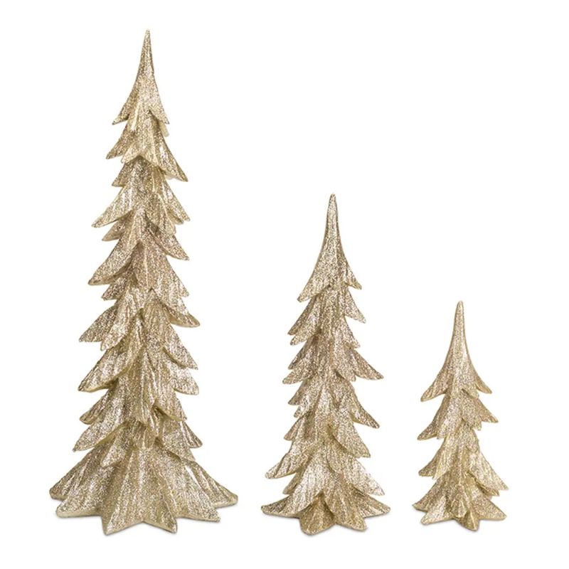 Photo 1 of Costco Holiday Tree D�écor (Set of 3). Enhance your holiday home décor with this stunning set of Holiday Tree décor. Featuring three assorted sizes, the modern carved tree designs paired with the chic gold finish makes this set a great addition to any styl