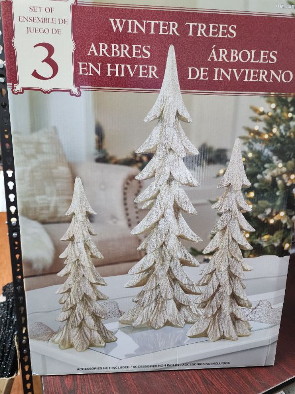 Photo 2 of Costco Holiday Tree Décor (Set of 3). Enhance your holiday home décor with this stunning set of Holiday Tree décor. Featuring three assorted sizes, the modern carved tree designs paired with the chic gold finish makes this set a great addition to any styl