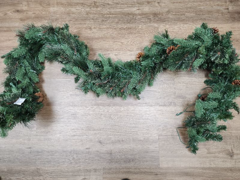 Photo 2 of Greenery Garland. Decorated With Natural Pinecones. Connect up to 4 Garlands Together End-to-End. For Indoor and Outdoor Use. For convenient, yet elegant holiday decorating, this greenery garland with natural pinecones will add a warm festive feel to your