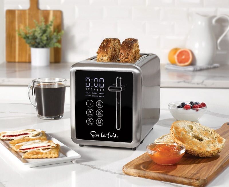 Photo 1 of Sur La Table Touchscreen 2 Slice Toaster. Multiple functions for roasting different types of bread: bread, bagels, English muffins, cakes, waffles, frozen foods and for overheating. 7 levels of toasting, from light to dark to toast the bread to your likin