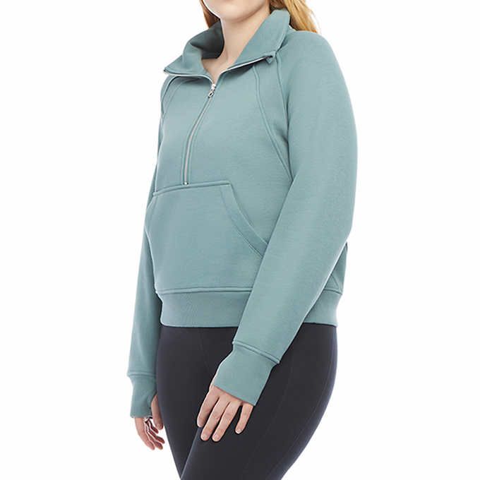 Photo 1 of SIZE L - Costco Danskin Ladies' Cozy Half-Zip Pullover. Super soft polyester/rayon/spandex brushed fleece construction. Front half zipper closure with kangaroo pocket and rib trim banded bottom. Lightweight, soft, breathable fabrication that will provide 