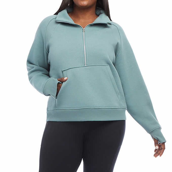 Photo 3 of SIZE L - Costco Danskin Ladies' Cozy Half-Zip Pullover. Super soft polyester/rayon/spandex brushed fleece construction. Front half zipper closure with kangaroo pocket and rib trim banded bottom. Lightweight, soft, breathable fabrication that will provide 