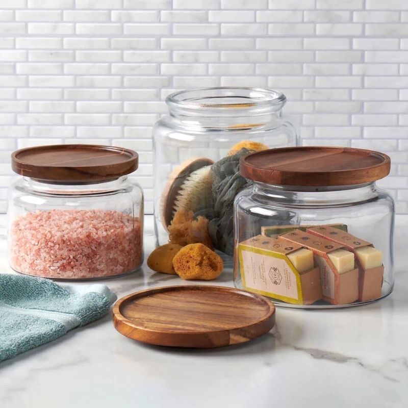 Photo 1 of NO LIDS - Anchor Hocking Montana Glass Jars with Acacia Lids, 96oz, 64oz, 48oz - Set of 3. These beautiful glass jars add a natural warmth to whatever room you put them in. The classic glass jars combine the best of both storage and display, and can be us