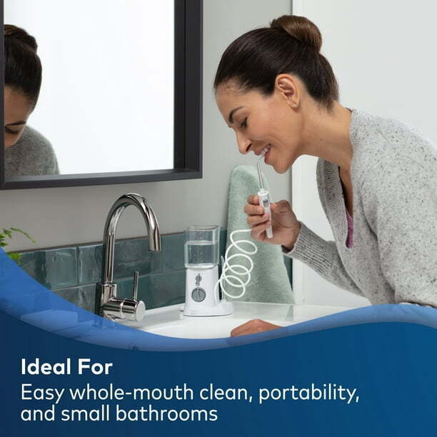 Photo 2 of Waterpik Nano Compact Water Flosser, WP-310 White. The Waterpik Nano WP-310 countertop water flosser in White delivers full-size water flosser performance in a compact and portable design, making it perfect for smaller spaces. The reservoir can be inverte