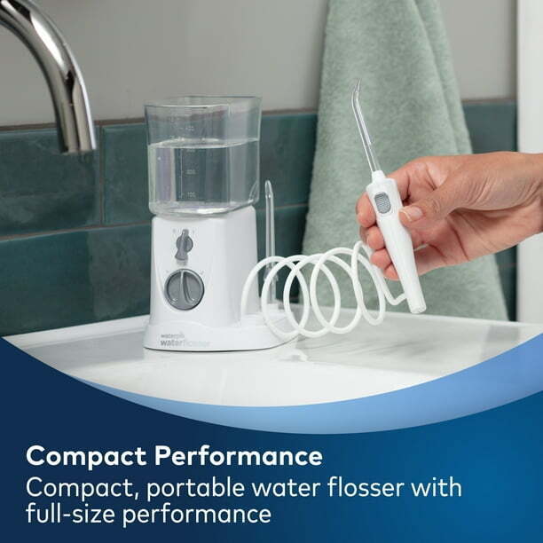 Photo 1 of Waterpik Nano Compact Water Flosser, WP-310 White. The Waterpik Nano WP-310 countertop water flosser in White delivers full-size water flosser performance in a compact and portable design, making it perfect for smaller spaces. The reservoir can be inverte