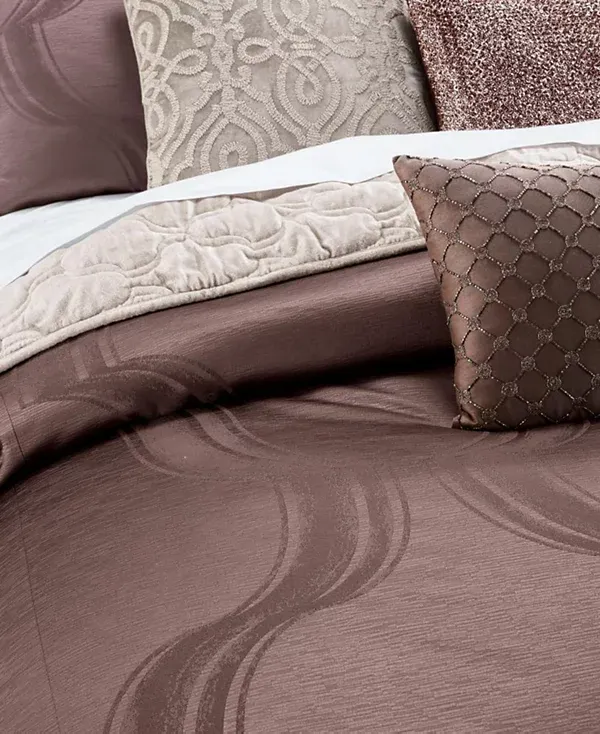 Photo 2 of FULL/ QUEEN - Create a rich and sophisticated look with Contour Bedding collection, featuring a textural woven jacquard with a dramatic oversized geometric design colored in a rich chocolate brown. This collection pairs with a pearly champagne velvet cove