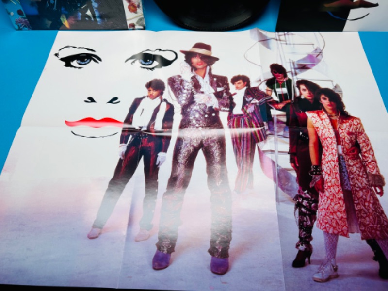 Photo 2 of 811104… Prince Purple Rain vinyl record with poster in plastic sleeve 33 rpm 