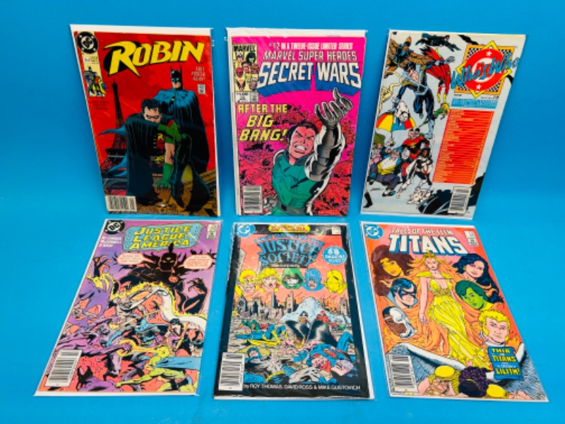 Photo 1 of 811174…6 older  comics in plastic sleeves 