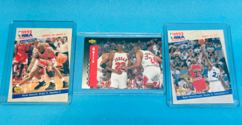 Photo 1 of 811198…3 Michael Jordan and the Bulls trading cards in hard plastic sleeves 