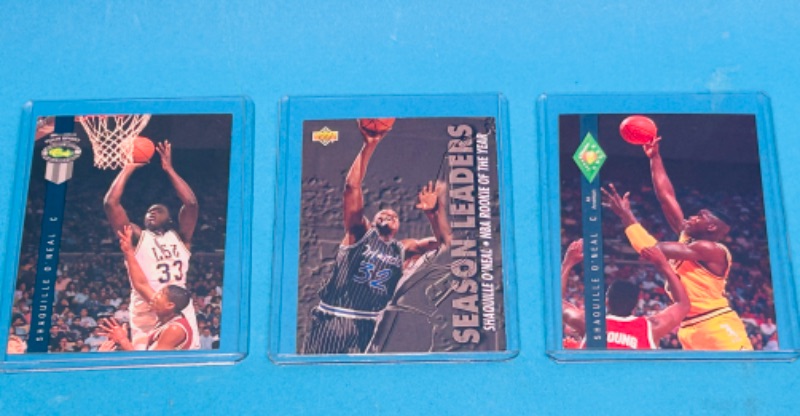 Photo 1 of 811199…3 Shaquille O’Neal trading cards in hard plastic sleeves 