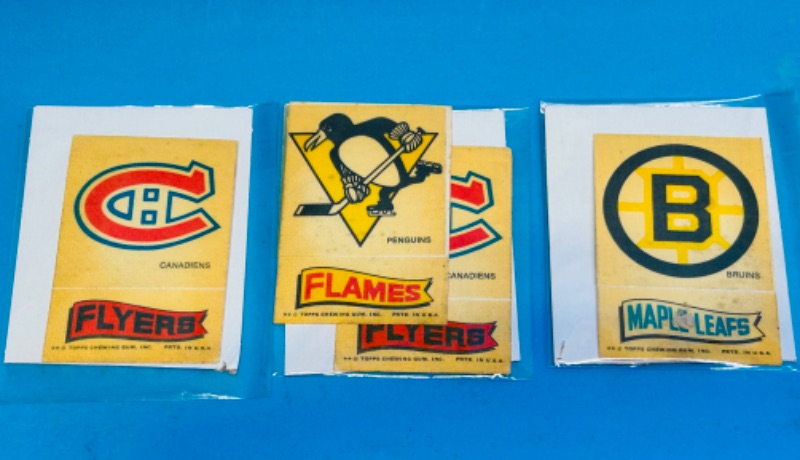 Photo 1 of 811262…vintage hockey helmet and stick decals in plastic sleeves 