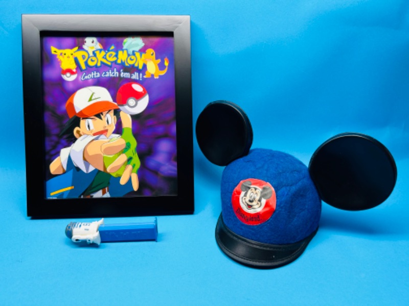 Photo 1 of 811301…vintage Disneyland ears, R2-D2 Pez, and framed Pokémon 