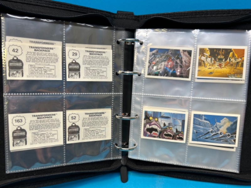 Photo 1 of 811388…60 vintage 1986 transformers backpack stickers in binder 