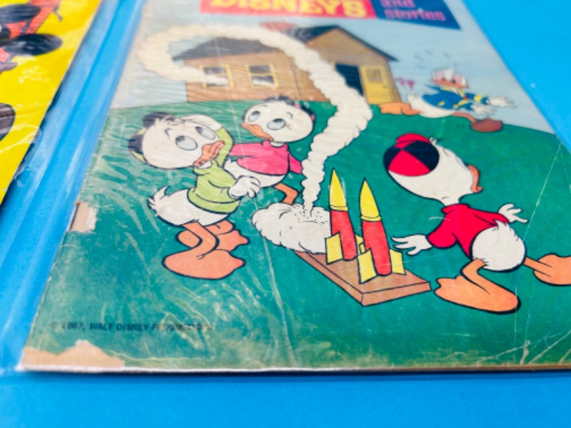 Photo 2 of 811404…damage- older comics with rips, stains, and more wear in plastic sleeves 