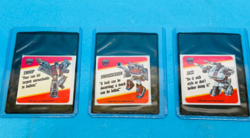 Photo 1 of 811407…1985 transformers stickers in plastic sleeves 