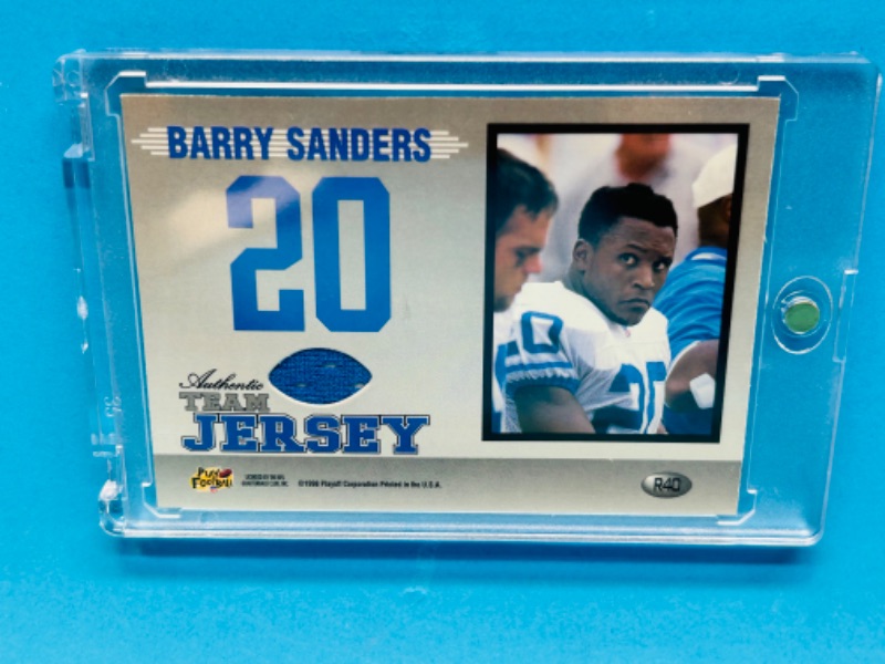 Photo 1 of 811416…Barry Sanders team jersey card in hard plastic case