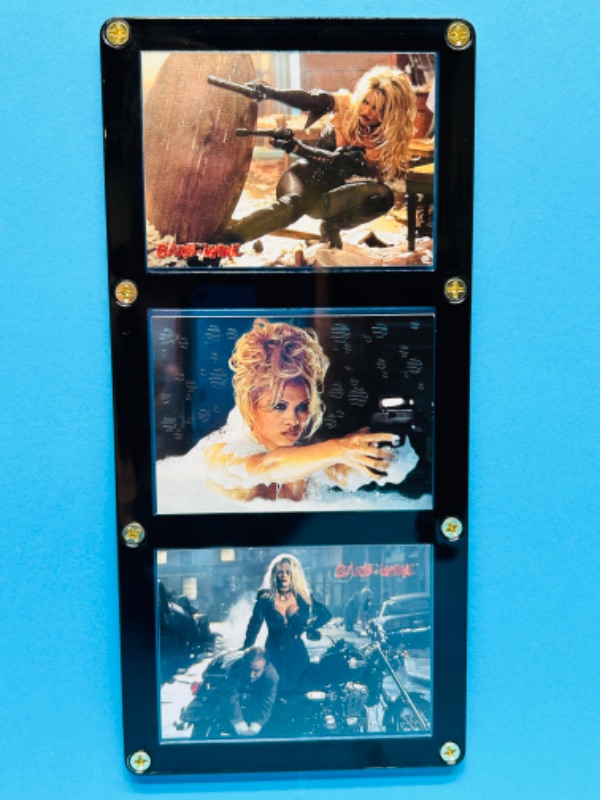 Photo 1 of 811423… 3 Pam Anderson Barb Wire cards in display case