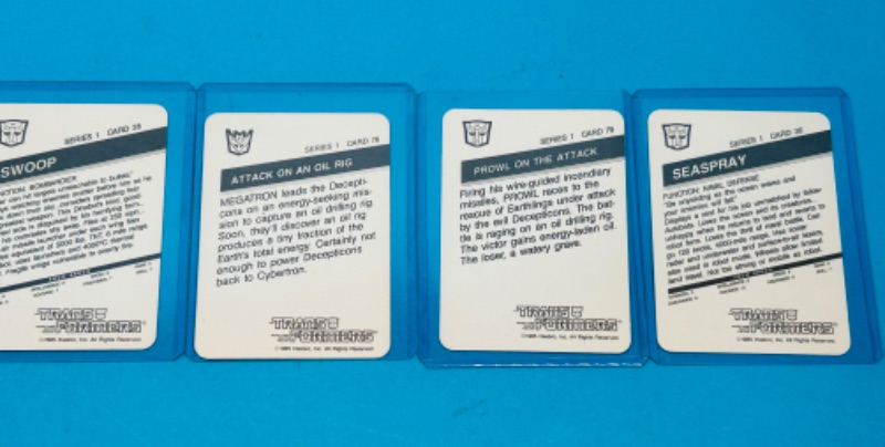 Photo 2 of 811456…4 vintage 1985 transformers series 1 cards in hard plastic sleeves 