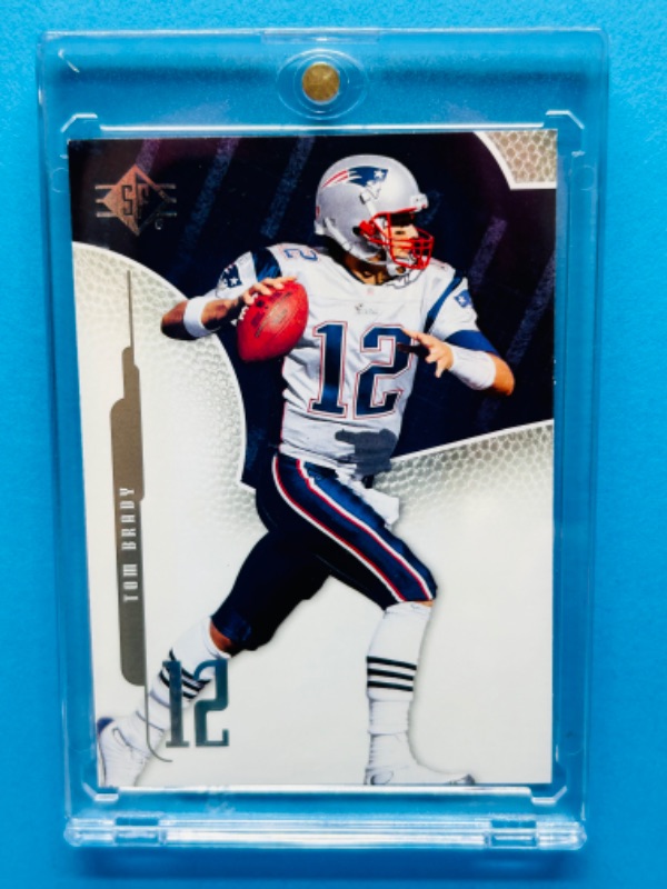 Photo 1 of 811525…Tom Brady card 7  in hard plastic case 