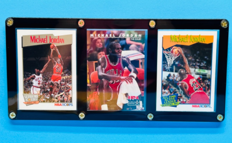 Photo 1 of 811530…3 Michael Jordan cards in display case