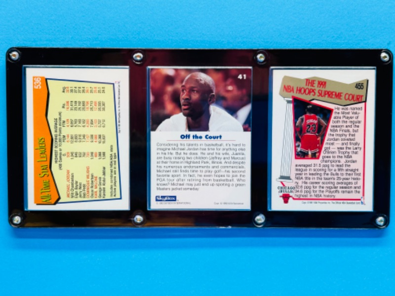 Photo 2 of 811530…3 Michael Jordan cards in display case