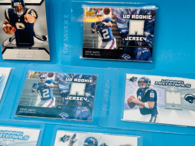 Photo 3 of 811613…7 football jersey relic Rookie cards in hard plastic sleeves 