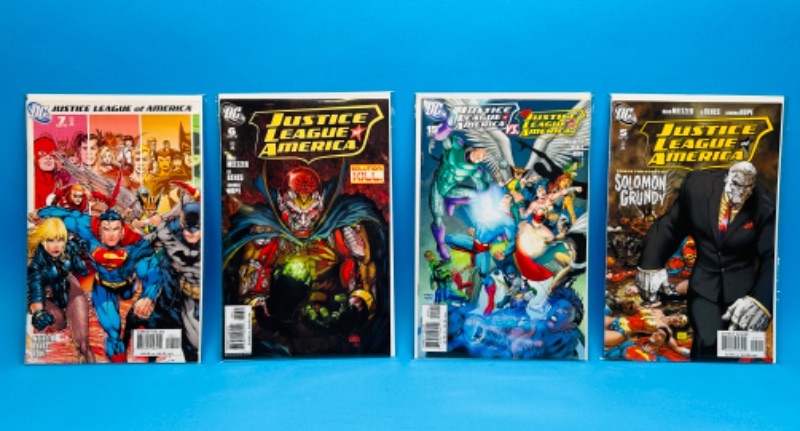 Photo 1 of 811629…4 JLA  comics in plastic sleeves 