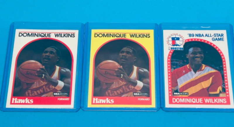 Photo 1 of 811694…3 Dominique Wilkins cards in hard plastic sleeves 