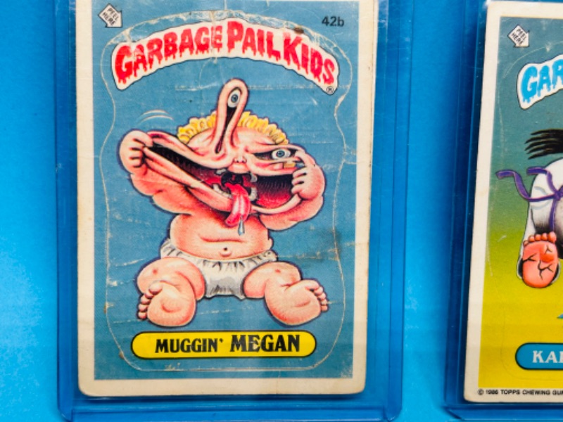 Photo 5 of 811745…11 damaged vintage garbage pail kids sticker cards in hard plastic sleeves- stains, bends, creases 