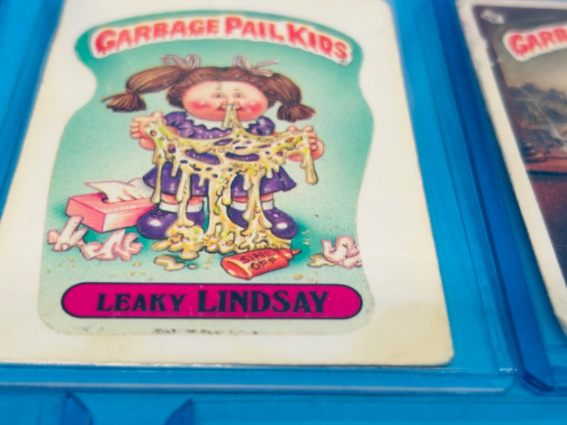 Photo 3 of 811745…11 damaged vintage garbage pail kids sticker cards in hard plastic sleeves- stains, bends, creases 