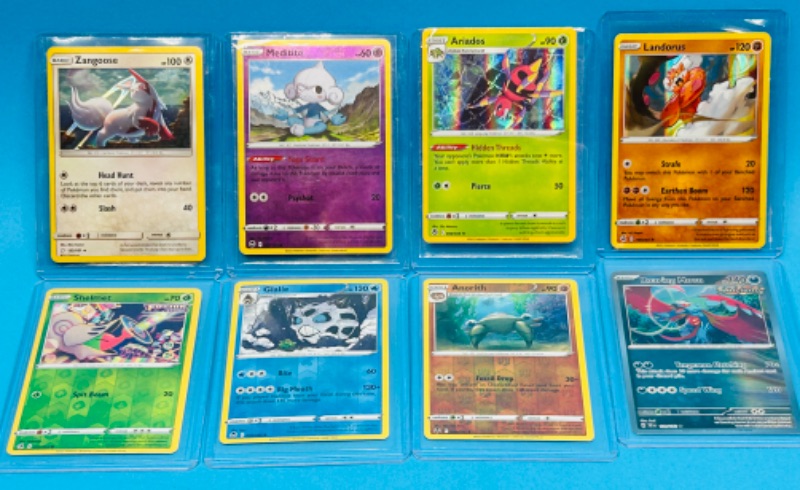 Photo 1 of 811749…8 Pokémon reverse holo and holo cards in plastic sleeves 