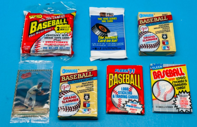 Photo 1 of 811816…7 sealed sports card packs