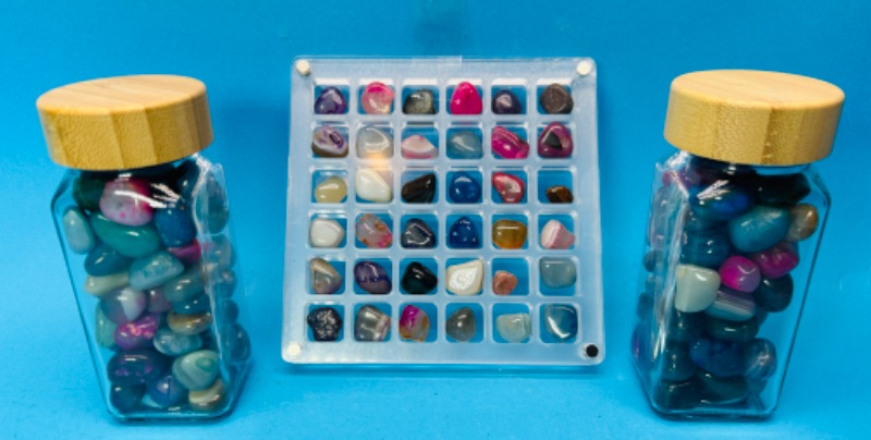 Photo 1 of 811972…2 bottles and grid of small polished rocks 4” tall