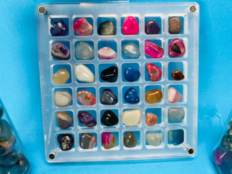 Photo 1 of 811972…2 bottles and grid of small polished rocks 4” tall