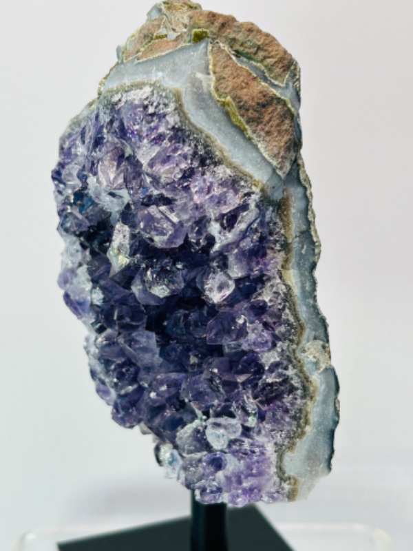 Photo 2 of 811990…6” amethyst crystal rock on display stand- height includes stand 