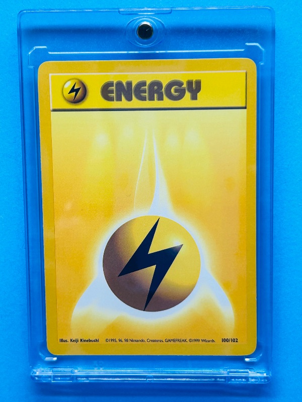 Photo 1 of 812046…Pokémon energy  card in hard plastic case 100/102