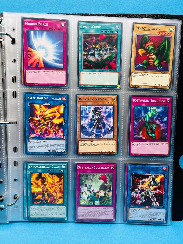 Photo 1 of 812256… final sale no returns/refunds -135 mixed Yu-Gi-Oh cards in binder -some holo